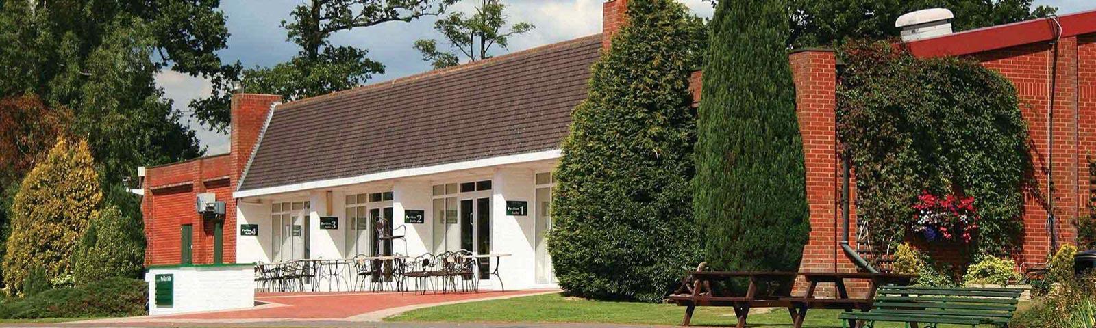 View of the front side of the private boxes, with tables and chairs set up.