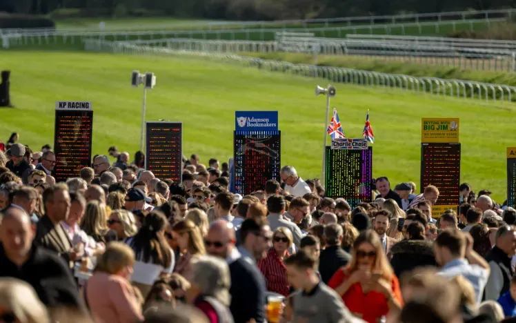 The crowd at Lingfield in front of the bookmakers and the track
