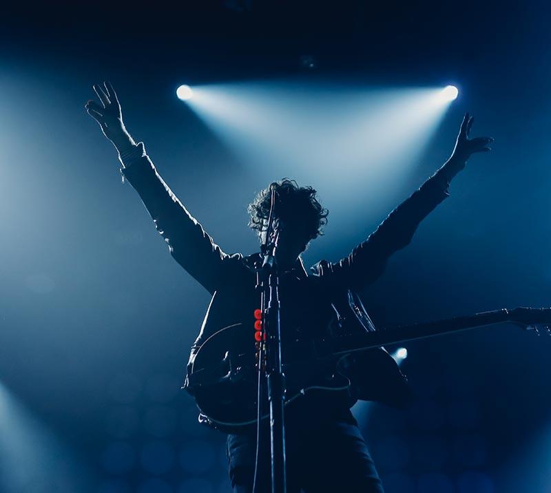 Silhouette of a performer at a live music gig
