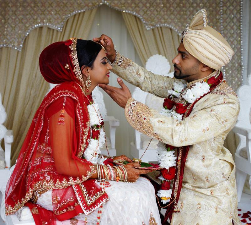 Asian couple during their wedding ceremony.