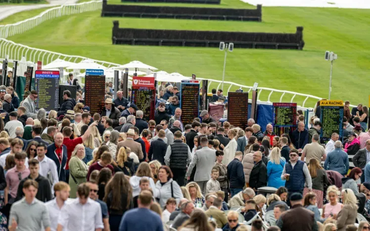Crowds next to the track and around the bookmakers at Lingfield Park