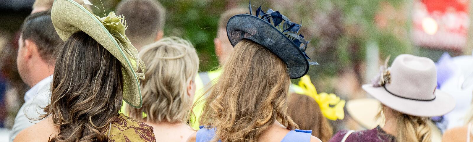 Ladies walking dressed up in their best outfit for Ladies Day