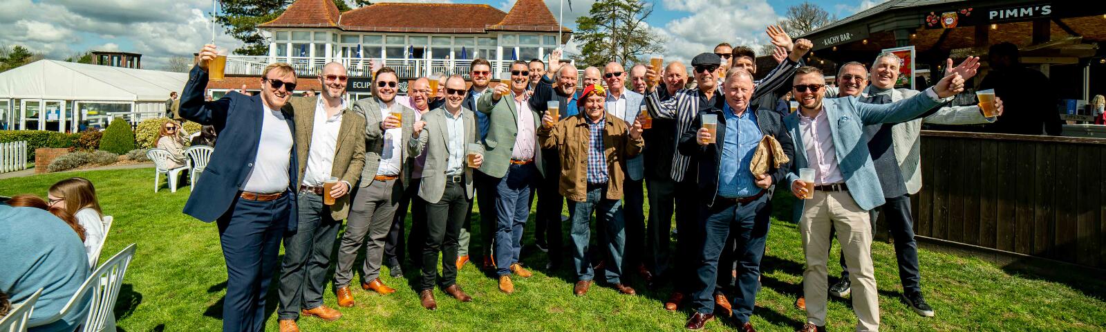 A large stag do posing for a picture at Lingfield Races